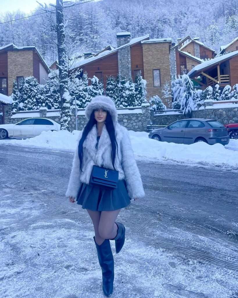16. Snowy White Fur Jacket with Mini Skirt and Boots