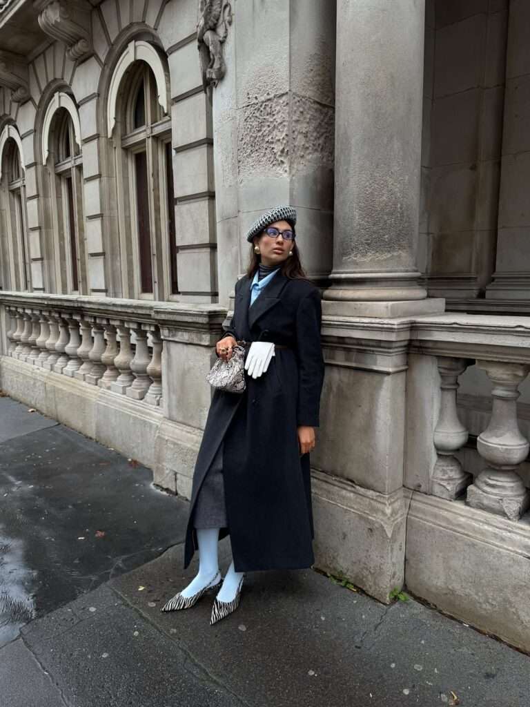 5. Classic Black Long Coat with Patterned Accessories