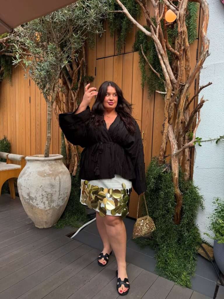 1. Black Blouse With a Statement White Mini Skirt